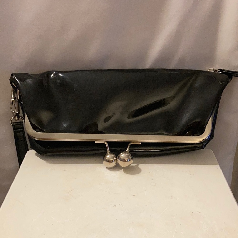 Black patent faux leather clutch.